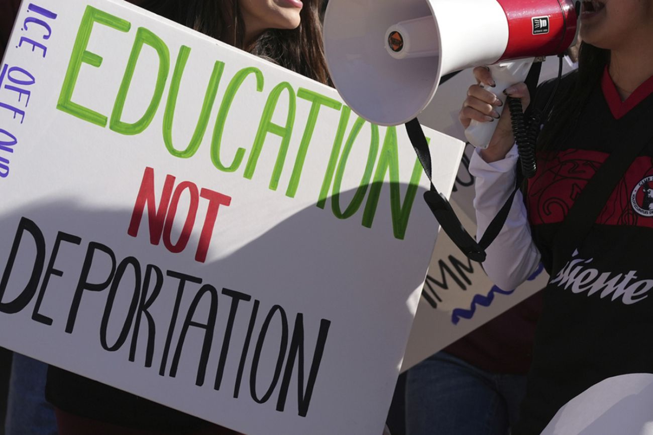 A sign that says "Education not Deportation."